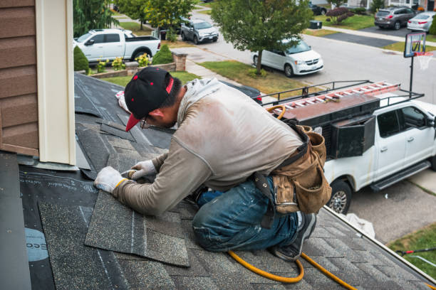 Professional Roofing technician working in Williamsburg, MI